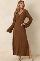 Front view of a brown textured semi-sheer maxi dress with long sleeves and a flowing silhouette.